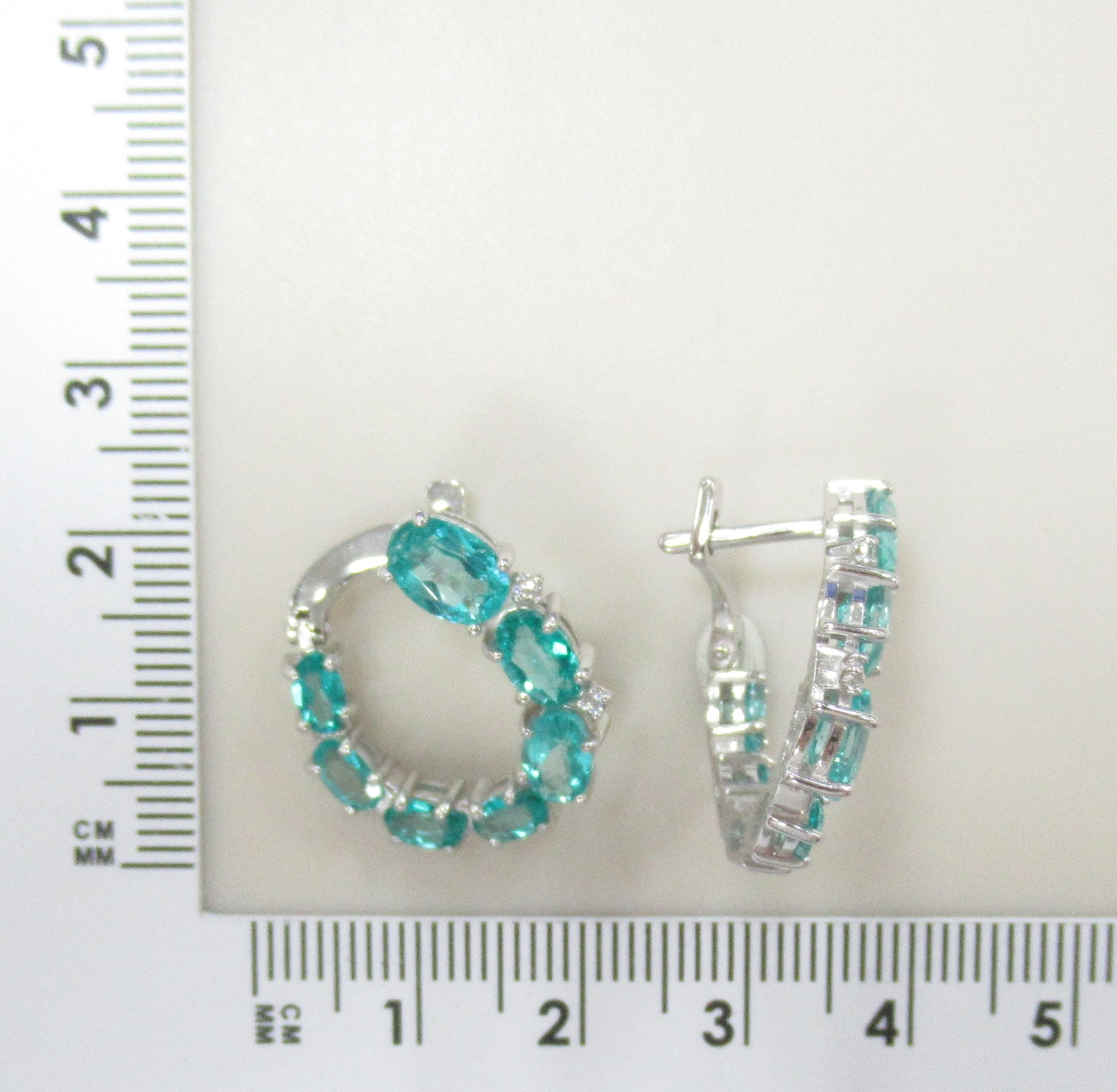 Серебряные серьги 925 пробы; вставки 14 Топаз (цв. Параиба); 4 Фианит бесцв.;